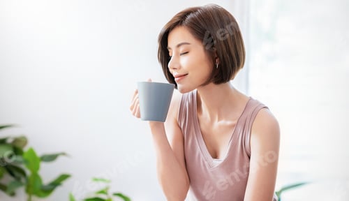 Preview: Beautiful asian woman hands holding coffee cup morning spring time
