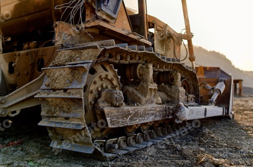 Preview: yellow excavator with a steering wheel digging out the ground summer sand truck
