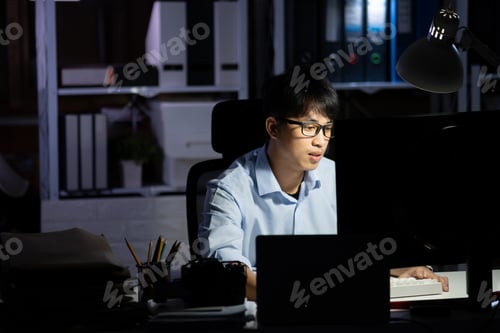 Preview: Businessman working overtime at his office He felt tired.