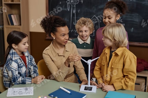 Preview: Diverse Group of Kids in School Listening to Female Teacher