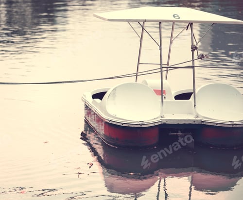 Preview: Paddle boat in a dark lake