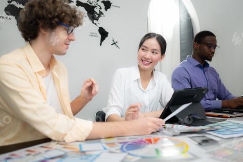 Preview: Multiethnic team of architects and designers are meeting to brainstorm design an application