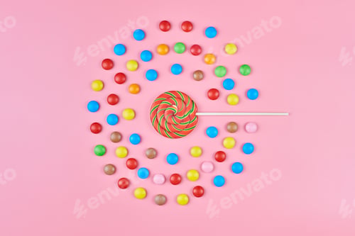 Preview: Sweet lollipop and candy on pink background