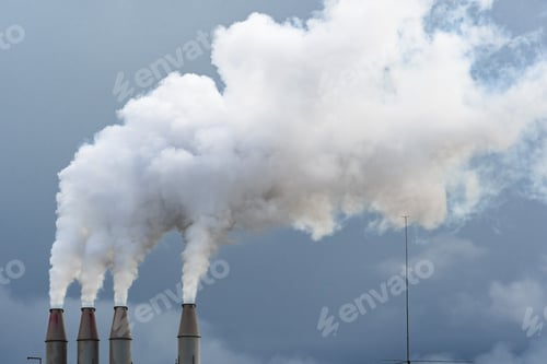 Preview: Smoke and steam rising into the air from power plant stacks