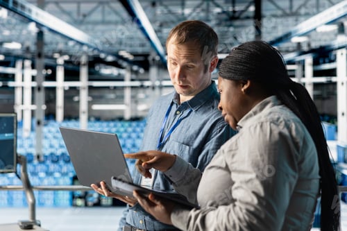 Preview: Team of data center admins using laptop to manage software updates