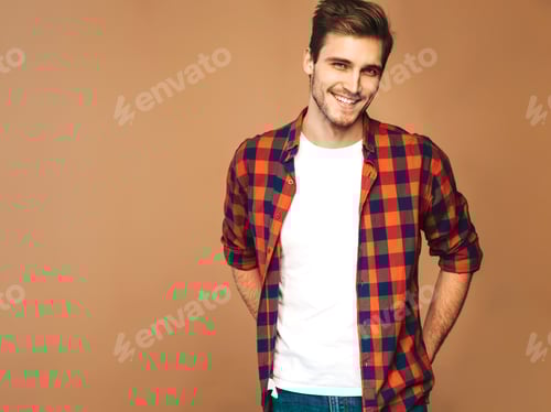 Preview: Portrait of young handsome man posing in studio