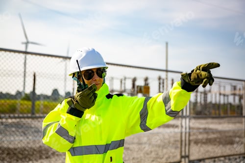 Preview: Professional maintenance engineer working at wind turbine farm