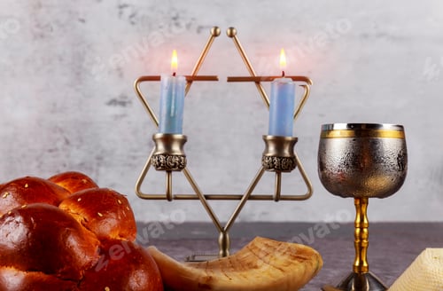 Preview: Shabbat with challah bread on a wooden table candles and cup of wine.