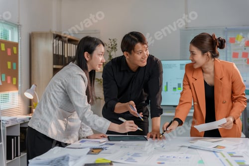 Preview: Marketing team analyzing financial statistics and discussing company strategy