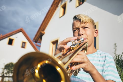 Preview: Little boy playing the trumpet