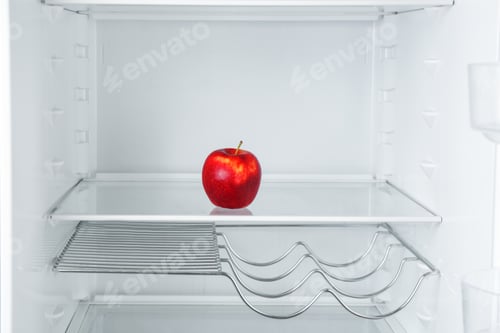 Preview: Fresh red apple on empty shelf in refrigerator