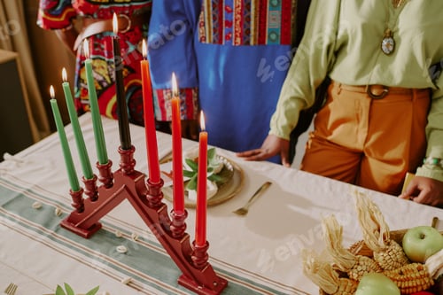 Preview: Diverse Young Adults Celebrating Kwanzaa Lighting Kinara Candles Together