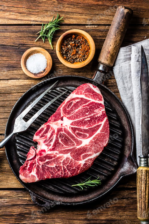 Preview: Raw marbled beef steak on grill pan