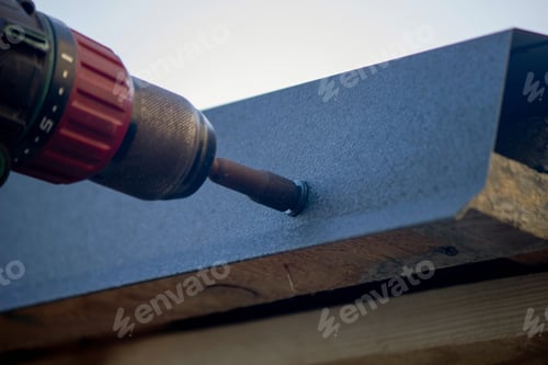 Preview: man repairing roof. Selective focus