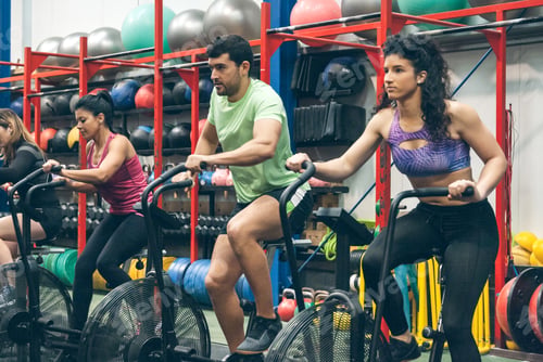 Preview: Athletes doing air bike indoor