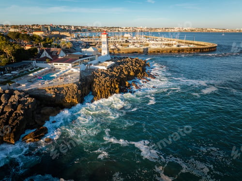 Preview: Aerial view of Santa Marta lighthouse and Cascais marina with Cascais cityscape