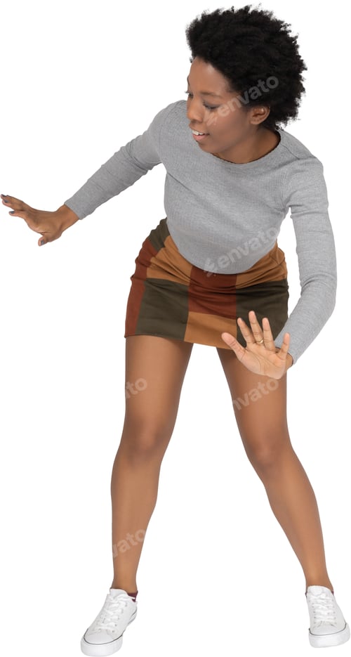 Preview: a woman wearing shorts and a gray shirt and white shoes
