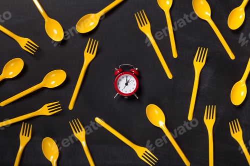 Preview: Top view on plastic forks on black background