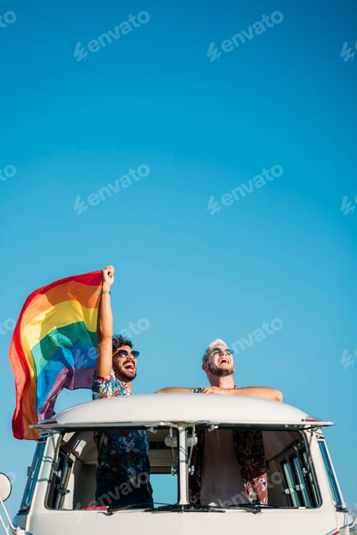 Preview: Gay couple in van holding LGBT flag