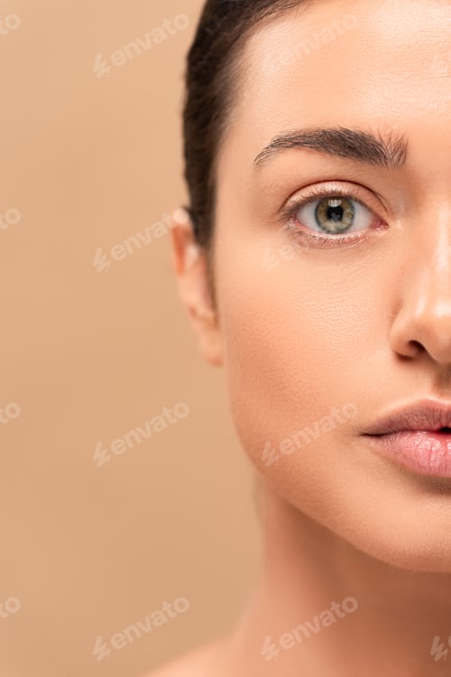 Preview: cropped view of girl with clean face looking at camera isolated on beige