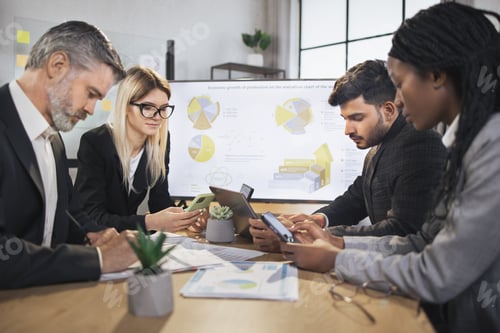 Preview: Diverse group of multiracial business people in the conference room with big TV screen
