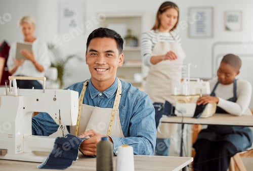 Preview: Fashion, design and style with a handsome, young designer working on a sewing machine in a bright w