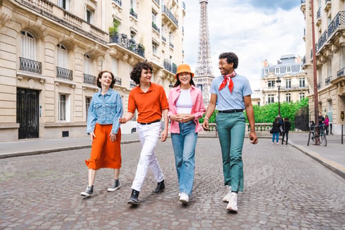 Preview: Group of young happy friends visiting Paris and Eiffel Tower