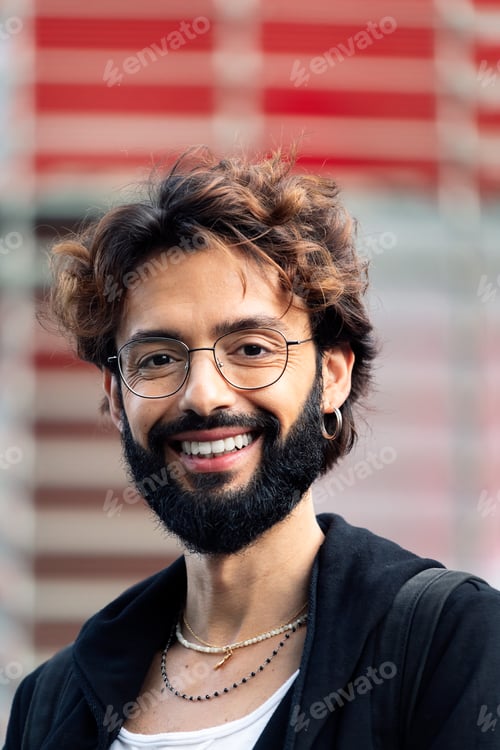 Preview: smiling young man with glasses and beard