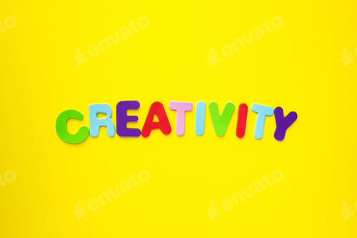 Preview: Creativity word by colored alphabet letters isolated on yellow background.