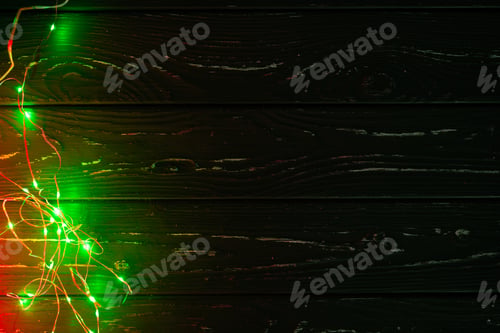 Preview: Garland with green light elements in the dark close up