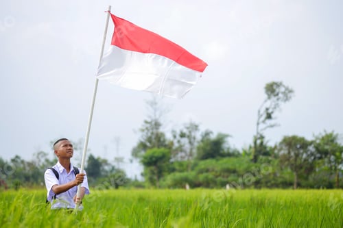 Preview: Teenager Holds Flag in a Field Outdoors