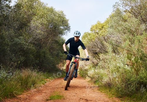 Preview: Race, fitness and cycling with woman on dirt path in nature for workout, training and competition.