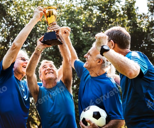 Preview: Team of mature football players winning the cup