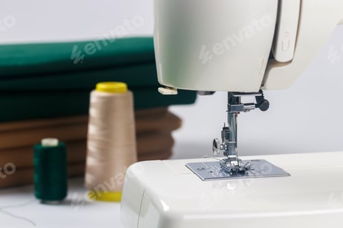 Preview: Photo of a needle with thread attached to sewing machine.