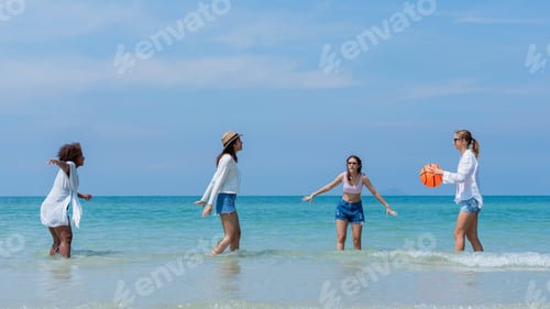 Preview: Happy children laughing and enjoying at beach. Teenage playing with friends at the sea.