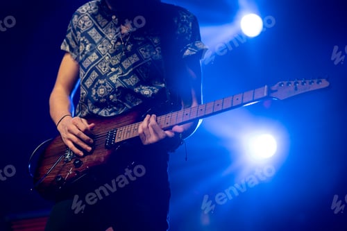 Preview: Close-up of guitarist in concert