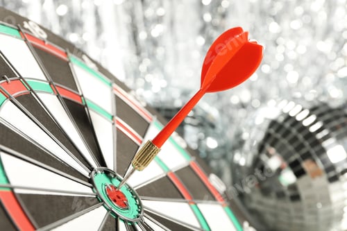 Preview: Darts hitting the target game at the party.