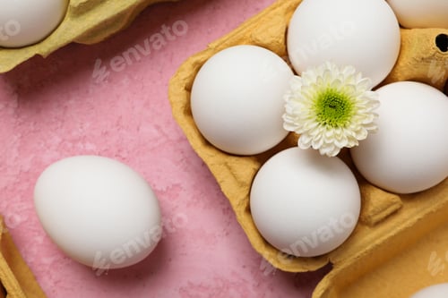 Preview: Concept of spring, eggs with flowers, top view