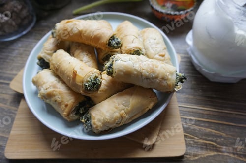Preview: Delicious Spinach Rolls on Plate on a Wooden Table