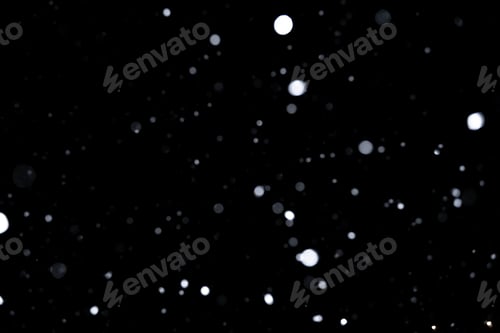 Preview: Element for winter design or overlay. Real snow over black background.