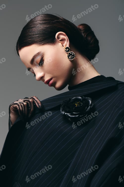 Preview: Young stylish woman showcasing elegant fashion in a modern studio setting during a photoshoot