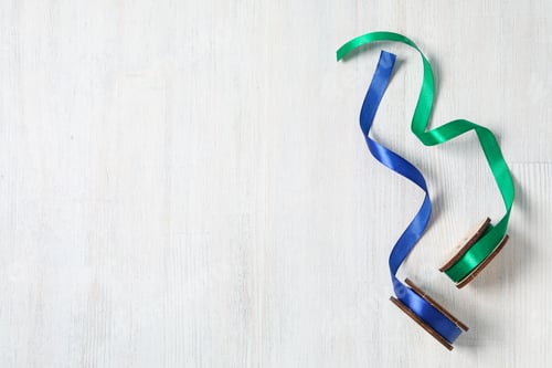 Preview: Skeins of ribbons on white wooden background