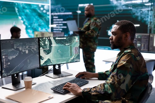 Preview: Military personnel in high tech command post work on data integration
