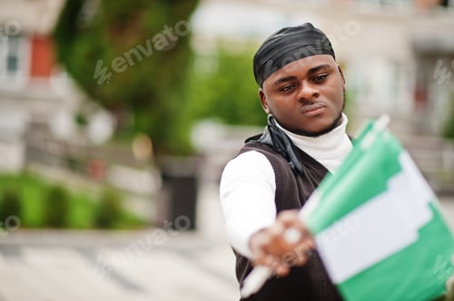 Preview: Young african man hold flag