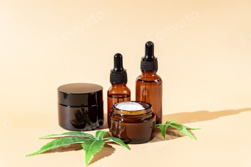 Preview: Cannabis face cream, serum or oil dropper concept. Natural cosmetic. CBD oil, THC tincture and hemp