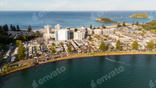 Preview: Aerial view of Mount Maunganui, New Zealand, with a vibrant coastal cityscape and ocean