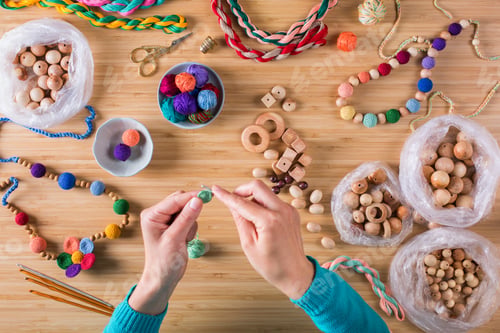 Preview: Hobby, crafting, creativity, time at home. Hands making baby beads