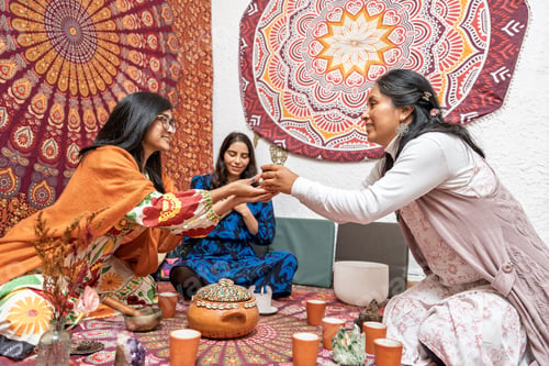 Preview: Women sharing organic cocoa during ceremony for alternative medicine and healthy living