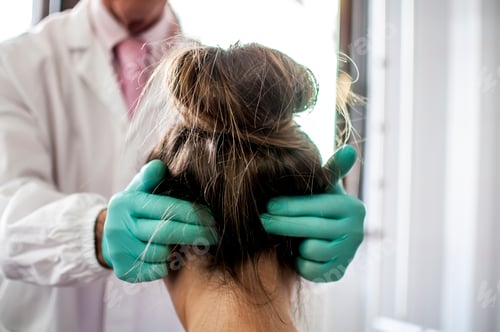 Preview: a doctor curing a bad cervical pain and headache of a young girl