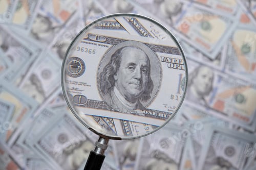 Preview: Hundred us dollar bill through magnifying lens checking banknotes